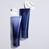 Two bottles of Supershine moisturizing cream with swatch of cream